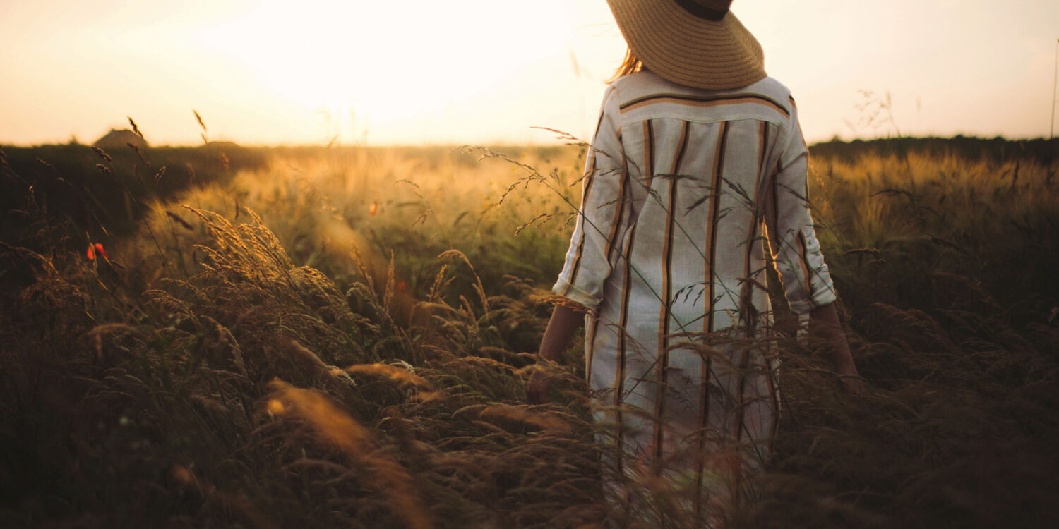 Womani n rustic dress and hat enjoying peace
